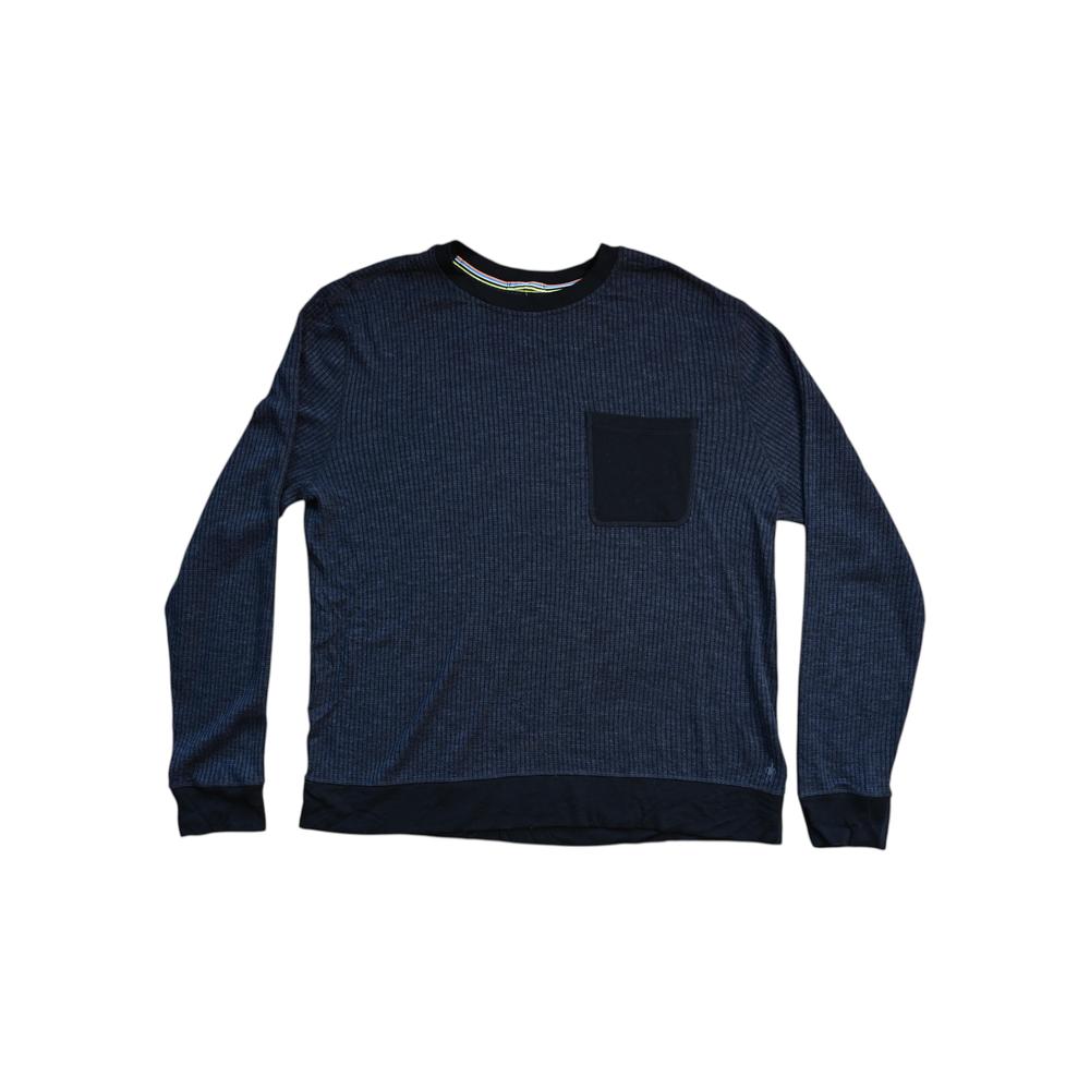 Black long-sleeved thermal baselayer shirt by Smartwool, with a chest pocket and ribbed texture.