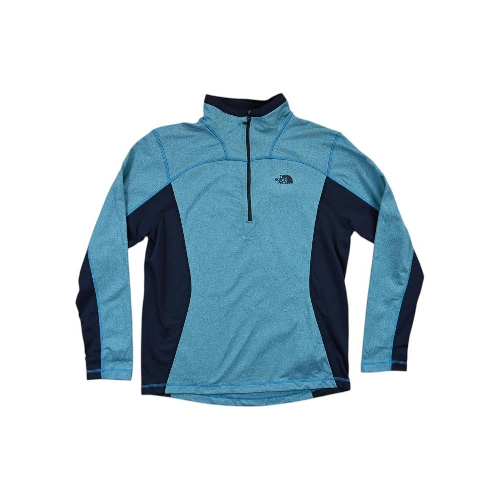 Blue active fleece quarter-zip by North Face, with contrasting dark blue side panels and the brand logo embroidered on the chest.