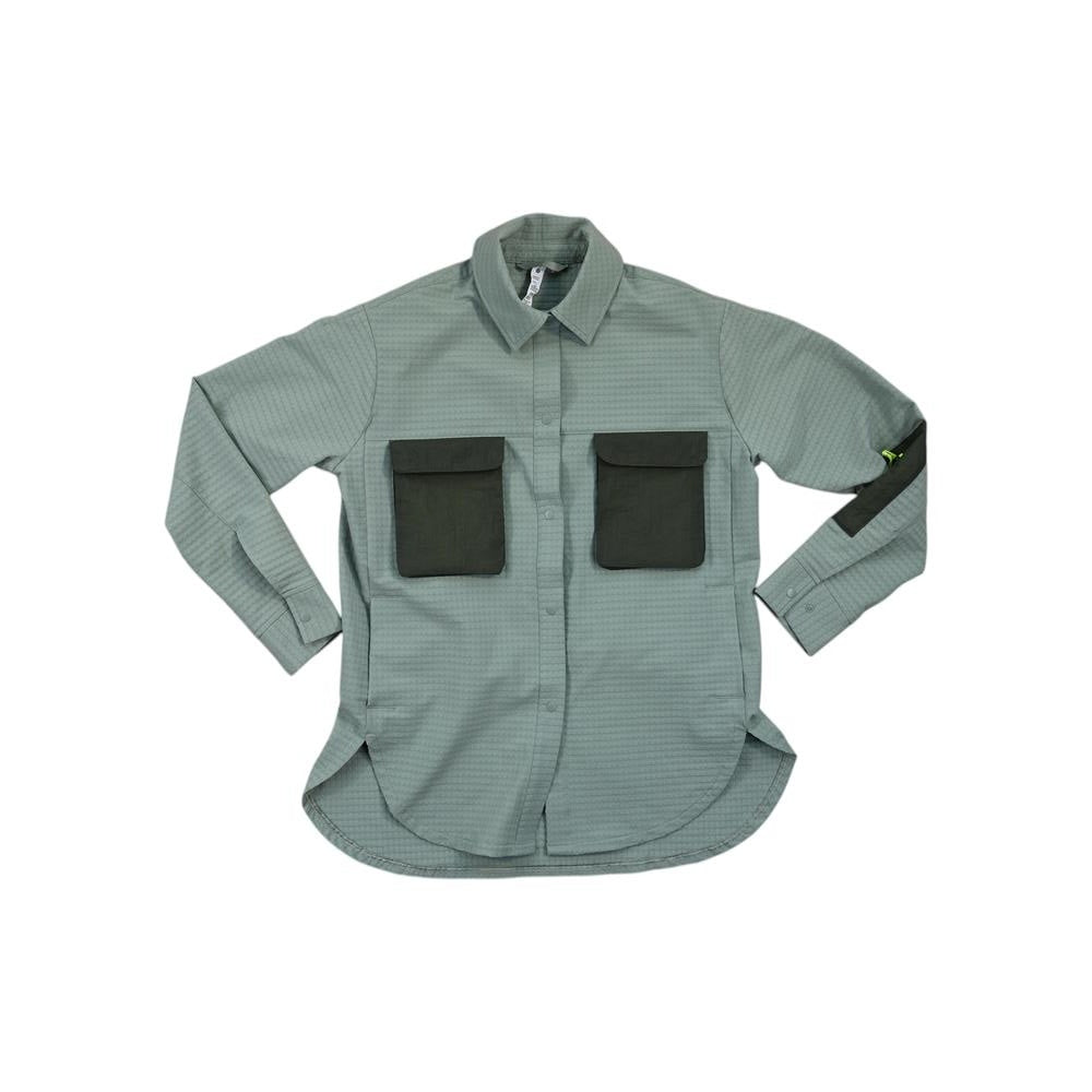 Green grid fleece overshirt by Lululemon with two dark green chest pockets and sleeve accent.
