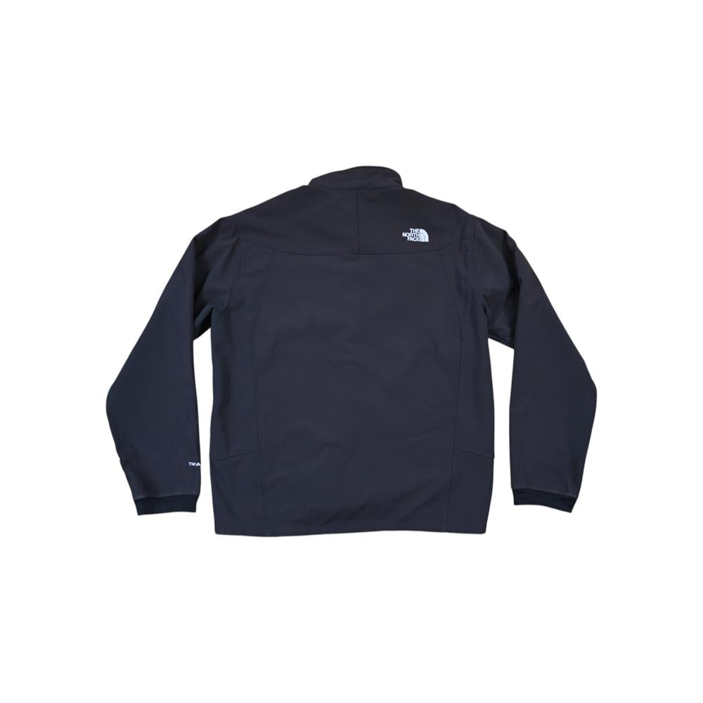 Black softshell jacket with fleece lining by North Face, back view with logo detail at the shoulder.