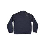 Black softshell jacket with fleece lining by North Face, back view with logo detail at the shoulder.