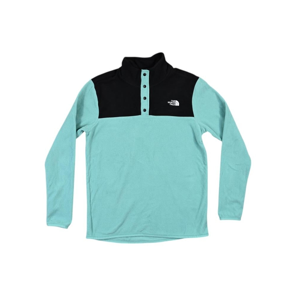 Blue fleece button up by North Face with a black upper section and a high neck.