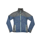 Blue softshell jacket by Mountain Hardwear featuring gray heathered shoulder and sleeve panels.