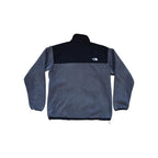 Fleece jacket in gray and black by North Face with long sleeves.
