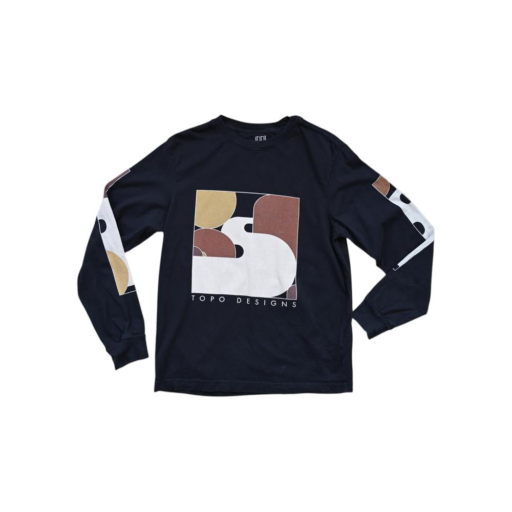 Black long sleeve shirt by Topo Designs with tan and brown abstract graphic on the front.
