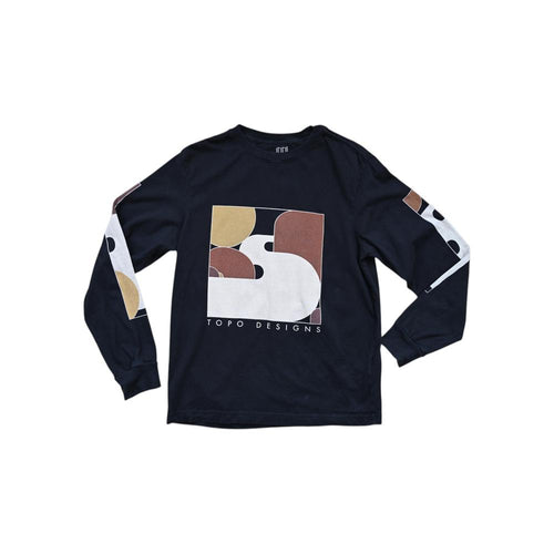 Black long sleeve shirt by Topo Designs with tan and brown abstract graphic on the front.