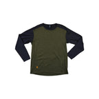 Two-tone baselayer long sleeve shirt by Flylow, in green and black, with a small logo on the front.