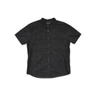 Grey button up shirt by Dakine with a patterned weave and short sleeves.