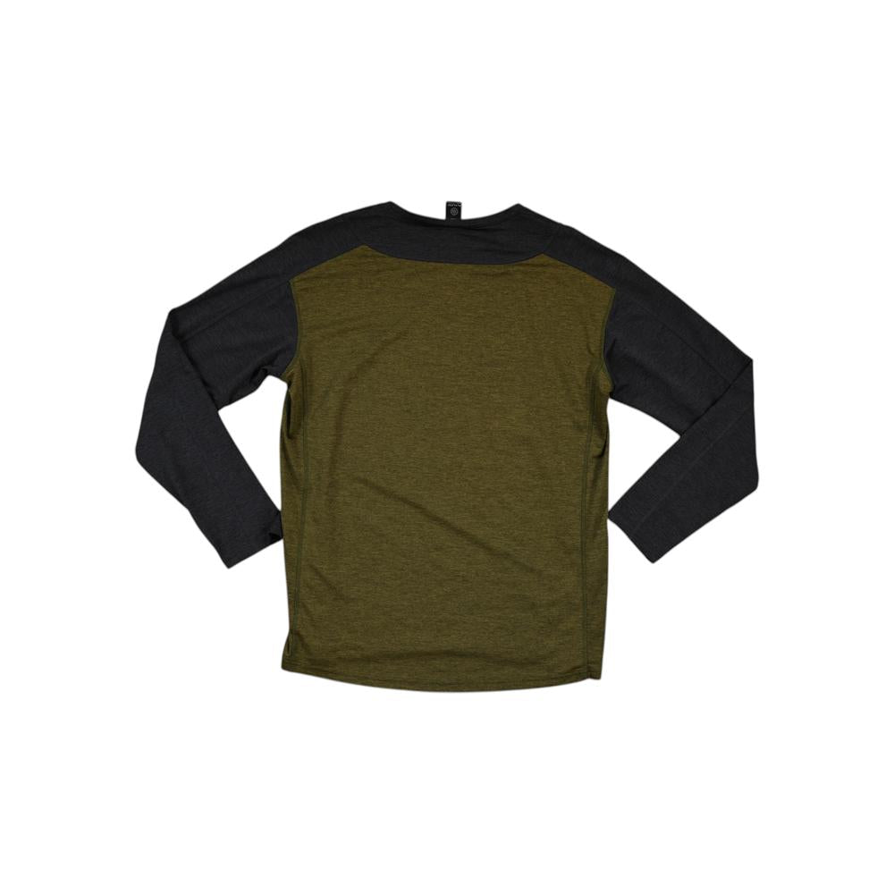 Green and black long-sleeve baselayer shirt by Flylow, shown on a white background.