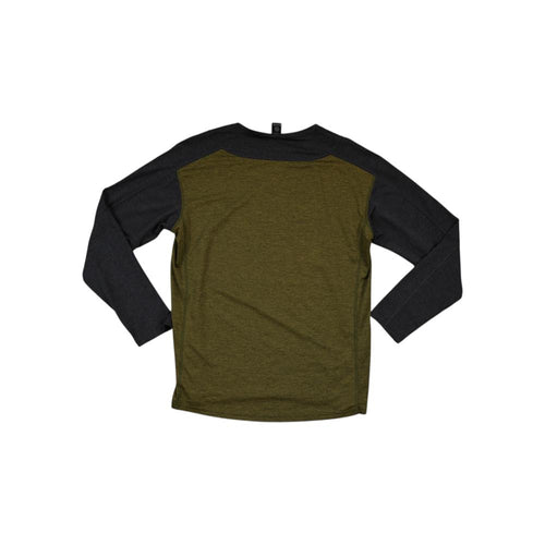 Green and black long-sleeve baselayer shirt by Flylow, shown on a white background.