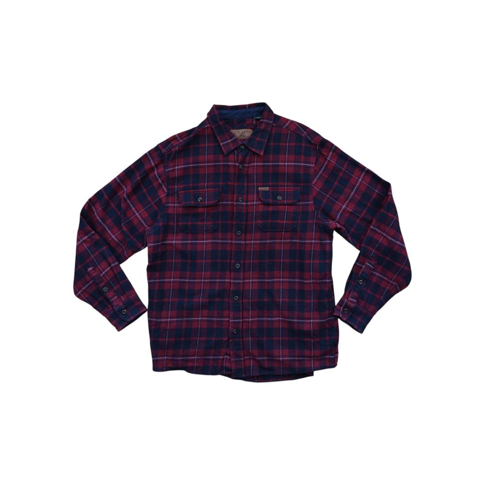 Navy flannel long sleeve shirt by Orvis, featuring a red and blue plaid pattern and chest pockets.