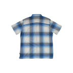 Blue button-up shirt by Kuhl with short sleeves and a plaid pattern.