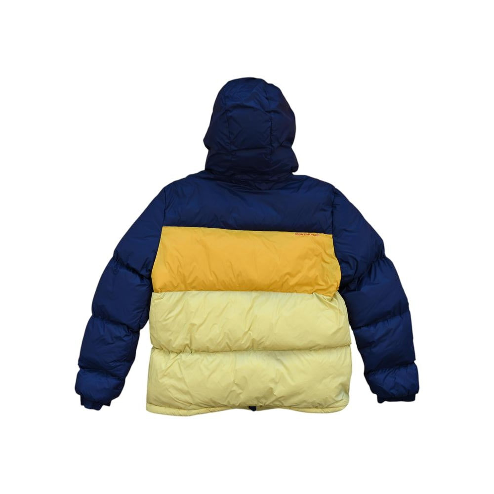 Navy and yellow down insulated jacket by Cotopaxi, featuring a hood, and a color block design from the back view.
