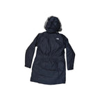Black insulated parka jacket by North Face with a fur-trimmed hood, back view.