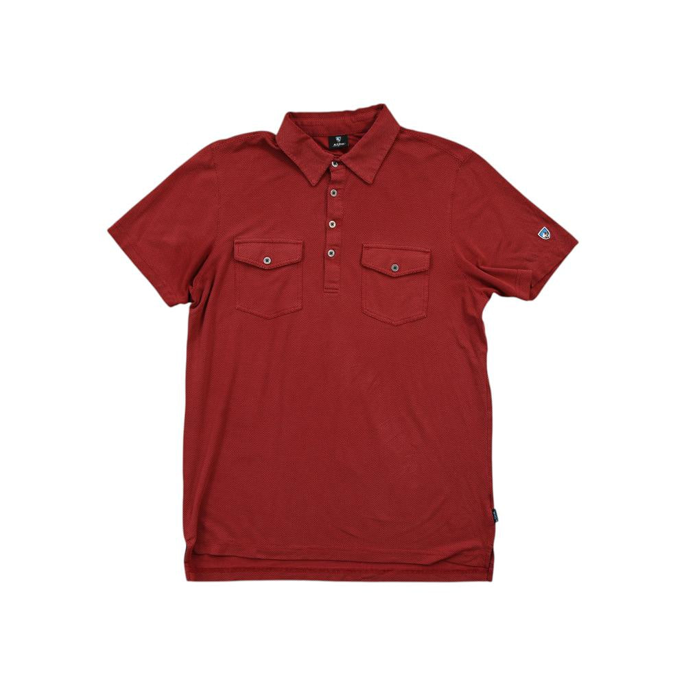 Red polo shirt by Kuhl with front pockets, and small logo on the sleeve.
