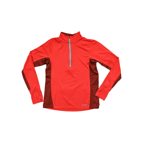 Red long sleeve baselayer shirt by Patagonia with quarter zip and contrasting side panels.
