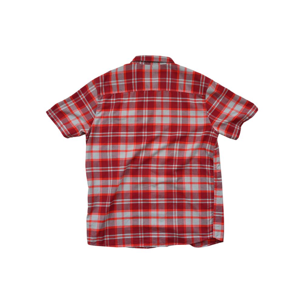 Red and gray plaid button-up shirt by Mountain Hardwear with short sleeves, seen from the back.