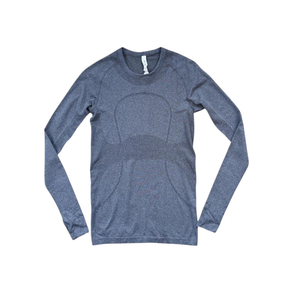 Gray long sleeve shirt by Lululemon with a fitted silhouette and breathable texture.