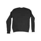 Gray crew sweater by Fjallraven with shoulder patches, long sleeves, and ribbed texture.