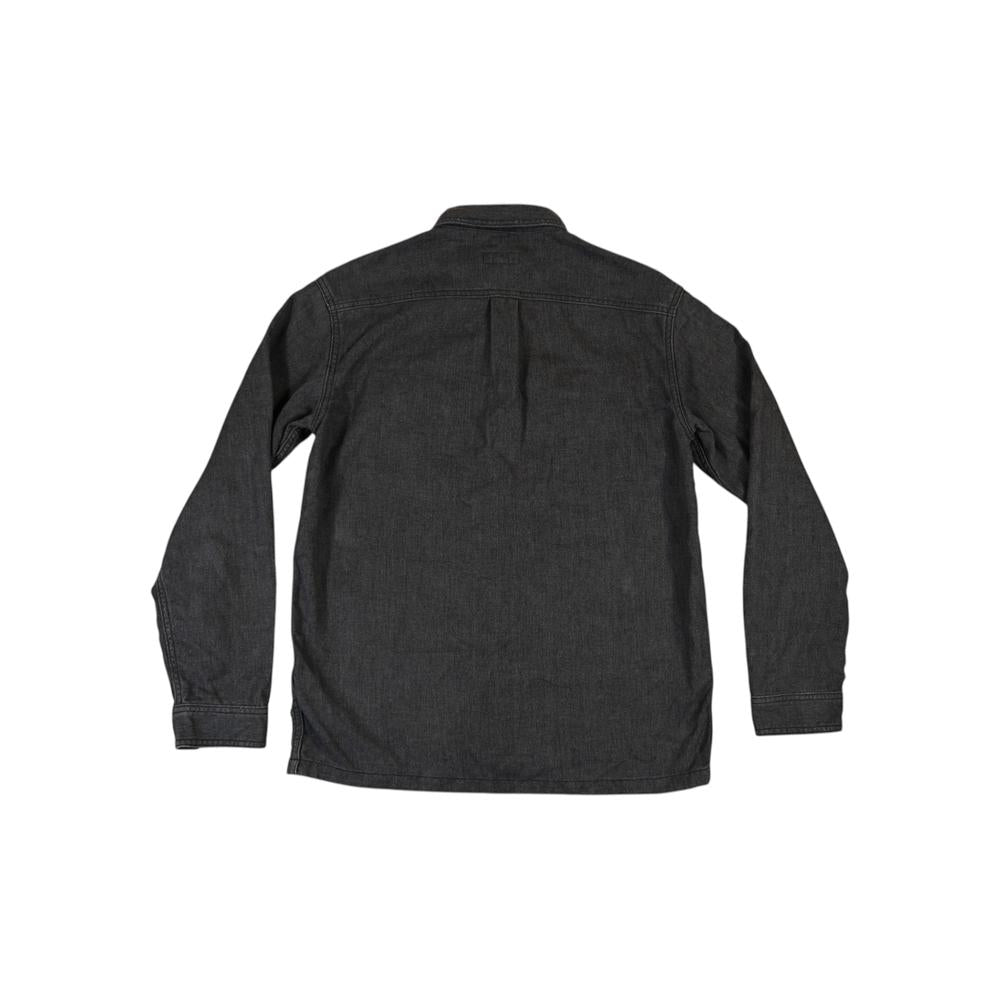 Blue workwear shirt by Patagonia, shown in back view.