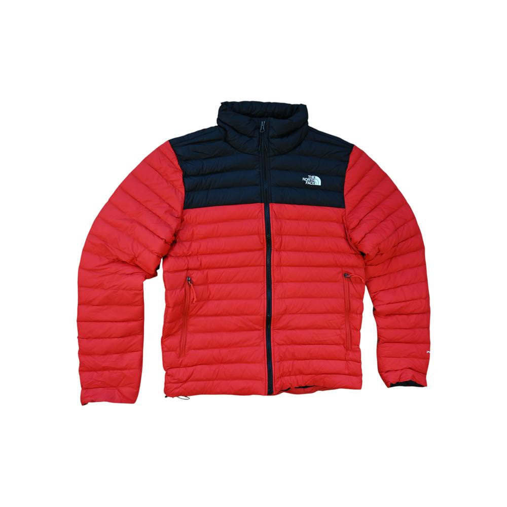 Red and black puffer jacket by The North Face with a full zipper.