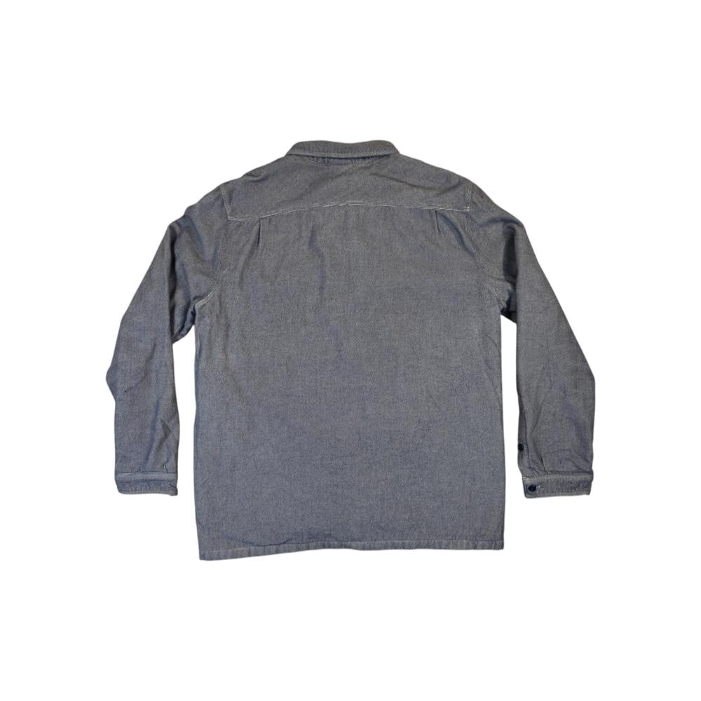 Blue insulated fjord shirt by Patagonia, seen from the back, with long sleeves and a straight hem.