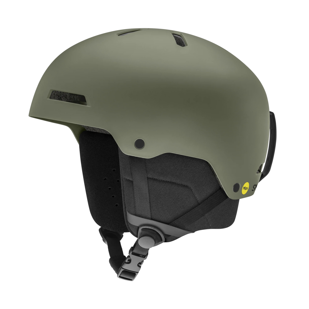 Matte sage snow helmet by Smith with black ear pads and a MIPS safety system.
